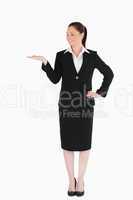 Cute woman in suit showing a copy space