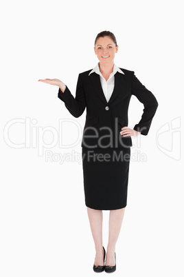 Charming woman in suit showing a copy space