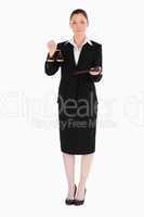 Charming woman in suit holding scales of justice and a gavel