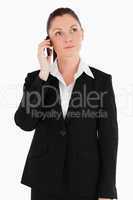 Good looking woman in suit on the phone