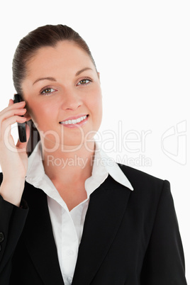 Portrait of a beautiful woman in suit on the phone