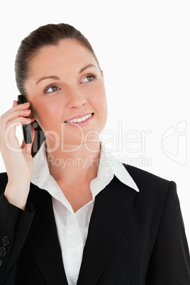 Portrait of an attractive woman in suit on the phone
