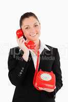 Cute woman in suit on the phone