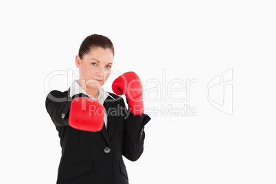 Good looking woman wearing some boxing gloves