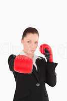 Cute woman wearing some boxing gloves