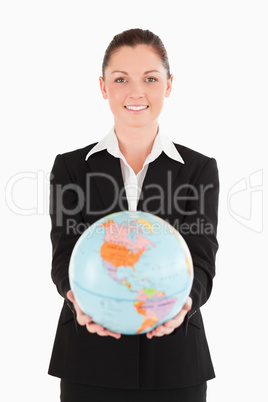 Pretty female in suit holding a globe