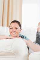 Lovely woman posing while lying on a sofa