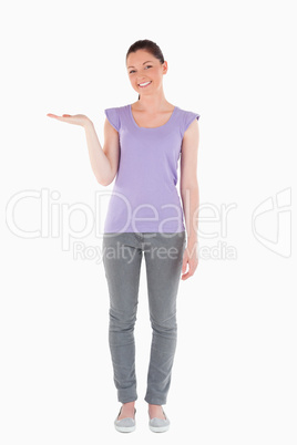 Attractive woman showing a copy space