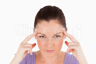 Portrait of a beautiful woman having a headache while standing