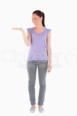 Good looking woman showing a copy space