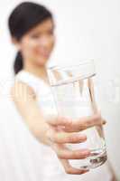 Asian Chinese Girl Holding Glass of Pure Water to Camera