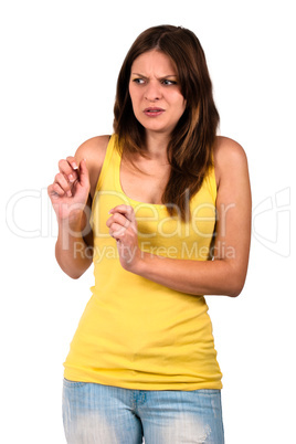 Young woman in a yellow dress looking disgusted