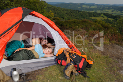 Camping young couple sleeping tent climbing gear