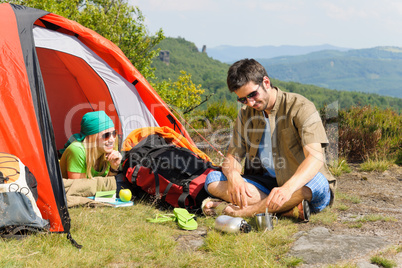 Camping young couple with tent summer countryside