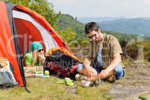 Camping young couple with tent summer countryside