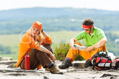 Hiking young couple relax at panoramic view