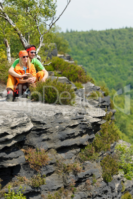 Hiking young couple relax at panoramic view