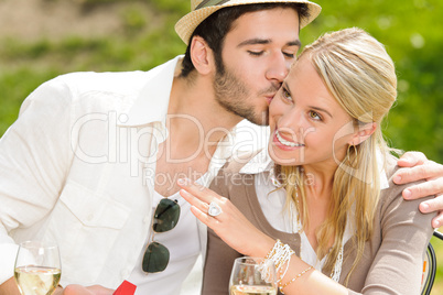 Happy woman receiving wedding ring sunny terrace