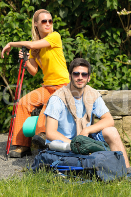 Hiking young couple backpack relax sunny day