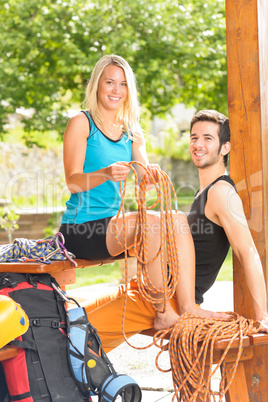 Active young woman climbing rope relax terrace