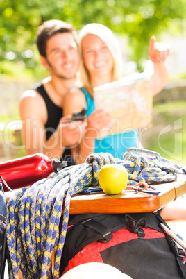 Young couple relax sunny terrace climbing gear