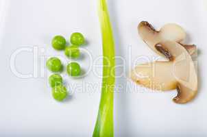 a summery composition with leek onion, champignon and peas