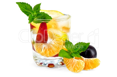 Fruit cocktail in a glass with plums