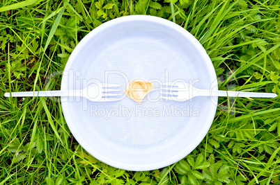 One chips on a white plate with forks