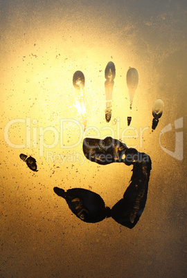 handprint on ice glass