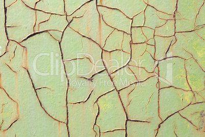 Texture of the old green paint on the metal