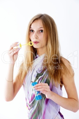 Attractive girl with soap bubbles