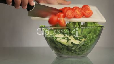 Cutting tomato salad