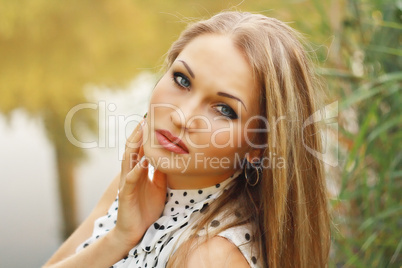 beautiful blonde girl  in white gown