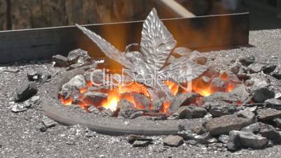 Iron butterfly is tempering on hot coals.