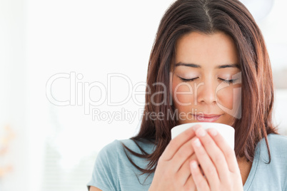 Portrait of a beautiful woman enjoying a cup of coffee