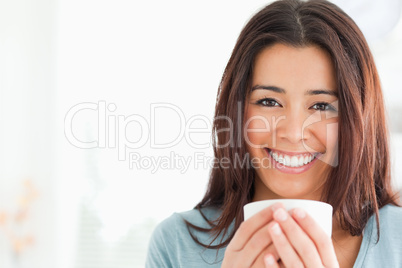 Portrait of an attractive woman enjoying a cup of coffee