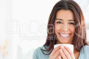 Portrait of an attractive woman enjoying a cup of coffee
