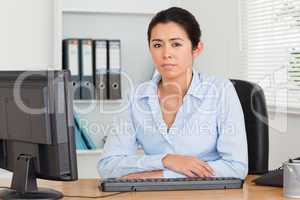 Good looking woman posing while sitting