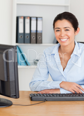 Charming woman posing while sitting