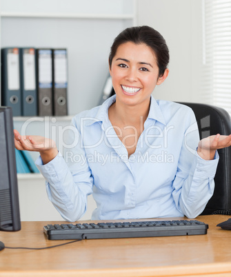 Proud attractive woman posing while sitting