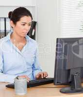 Beautiful woman working on a computer while sitting