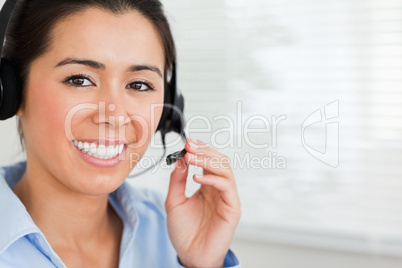 Portrait of a beautiful woman with a headset helping customers w