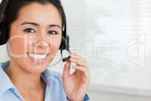 Portrait of a beautiful woman with a headset helping customers w