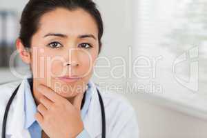 Lovely female doctor with a stethoscope posing