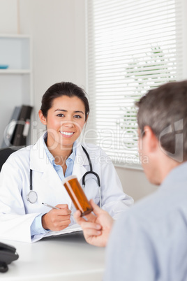 Patient holding a box of pills given by his doctor