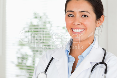 Portrait of a beautiful female doctor with a stethoscope posing