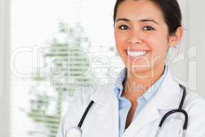 Portrait of a beautiful female doctor with a stethoscope posing