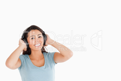 Attractive woman with headphones posing