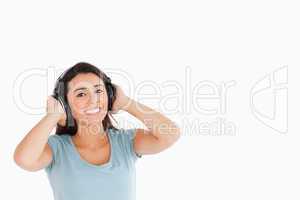 Attractive woman with headphones posing