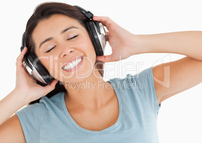 Portrait of a lovely woman using her headphones